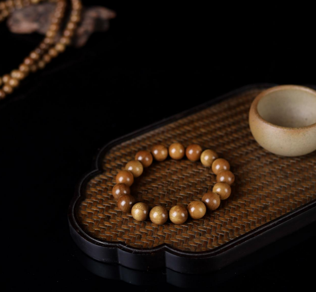 金丝楠木摆件寓意_金丝楠木手串价格_金丝楠老料横切面图片